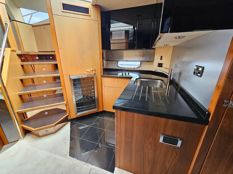 Slide: The Image of Luxurious kitchen interior of 2010 Sunseeker Predator 64 yacht with modern amenities. - 8