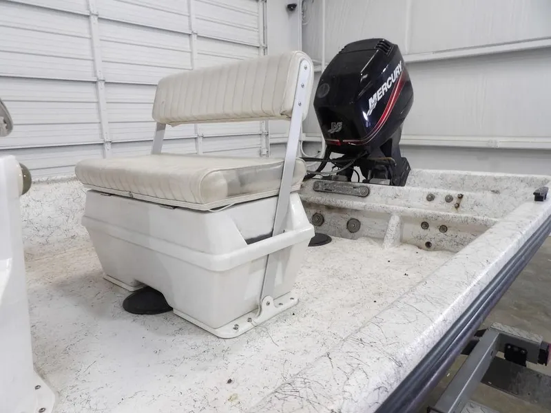 Slide: The Image of 2009 Kenner 180VX boat interior with Mercury outboard motor. - 12