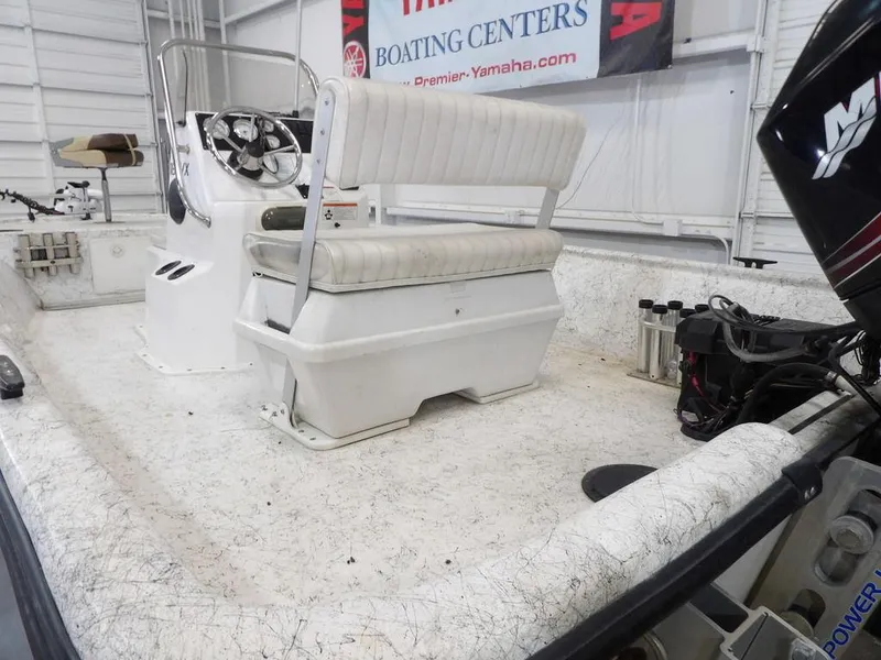 Slide: The Image of 2009 Kenner 180VX boat interior with steering console and seating. - 13