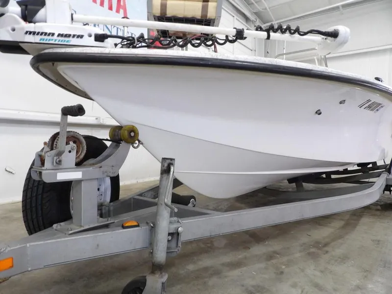Slide: The Image of 2009 Kenner 180VX boat on trailer in indoor storage. - 6
