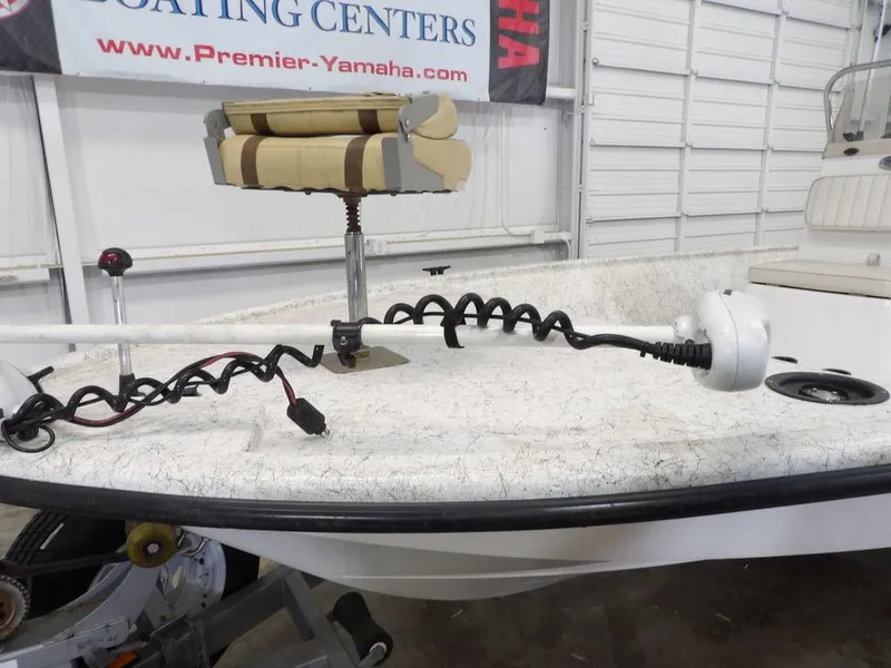 Slide: The Image of 2009 Kenner 180VX boat with trolling motor and swivel seat in a showroom. - 7