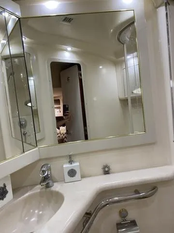 Slide: The Image of Luxurious bathroom in 2003 Sea Ray 550 Sundancer yacht with mirrored cabinets. - 11