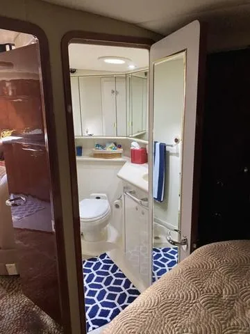 Slide: The Image of Bathroom interior of 2003 Sea Ray 550 Sundancer yacht with modern amenities. - 13