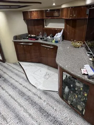 Slide: The Image of Luxurious interior of 2003 Sea Ray 550 Sundancer yacht with modern kitchen amenities. - 19
