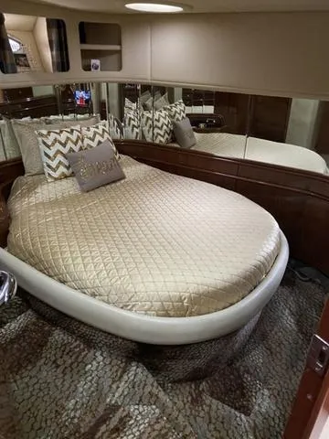 Slide: The Image of Luxurious bedroom interior of 2003 Sea Ray 550 Sundancer yacht with elegant bedding. - 20