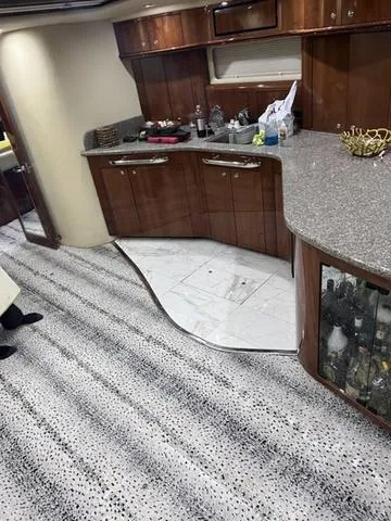 Slide: The Image of Luxurious 2003 Sea Ray 550 Sundancer yacht interior with modern kitchen and elegant design. - 21