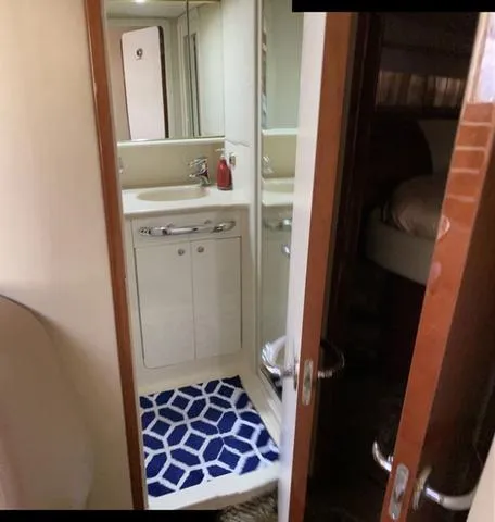 Slide: The Image of Bathroom interior of 2003 Sea Ray 550 Sundancer yacht with modern fixtures. - 9