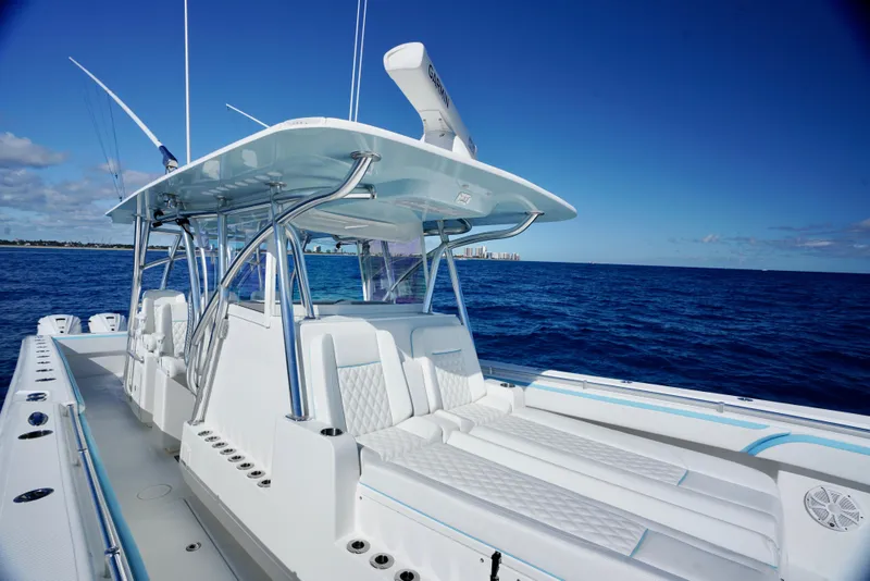 Slide: The Image of 2020 SeaHunter 46 CTS boat on open ocean under clear blue sky. - 10