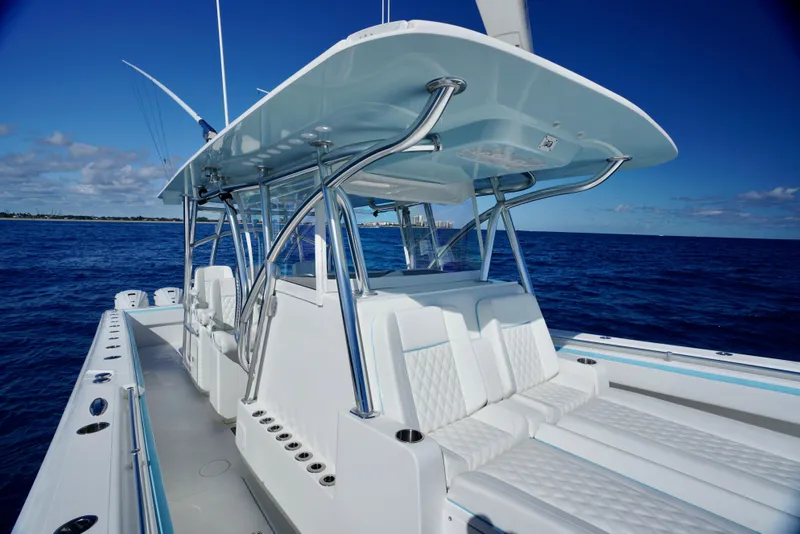 Slide: The Image of 2020 SeaHunter 46 CTS boat on open ocean, featuring sleek design and spacious seating. - 11