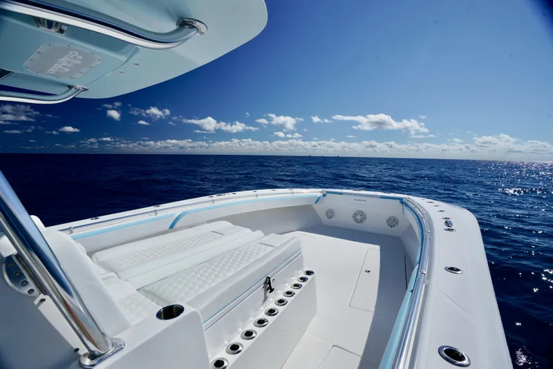 Slide: The Image of SeaHunter 46 CTS 2020 boat on open ocean under clear blue sky. - 13
