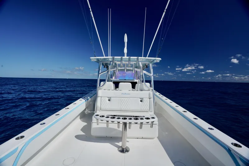 Slide: The Image of 2020 SeaHunter 46 CTS boat on open ocean, clear blue sky. - 7
