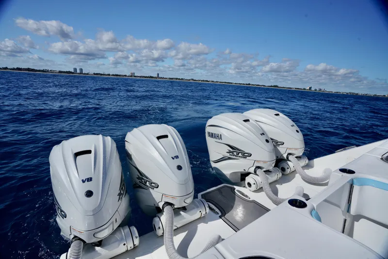 Slide: The Image of 2020 SeaHunter 46 CTS with Yamaha V8 engines on open water. - 9