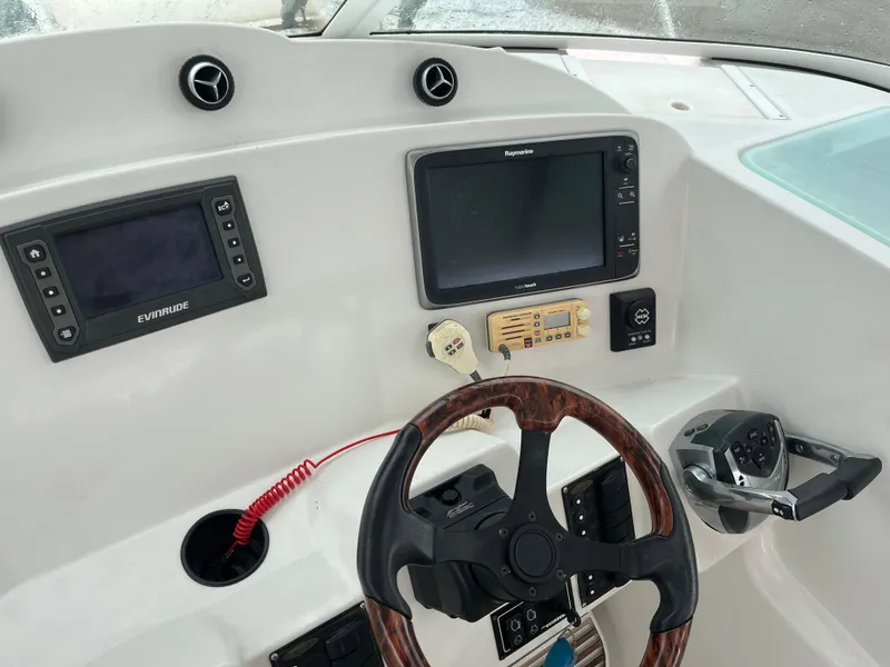 Slide: The Image of Control panel of 2004 Glacier Bay 3480 Ocean Runner boat with navigation equipment. - 11