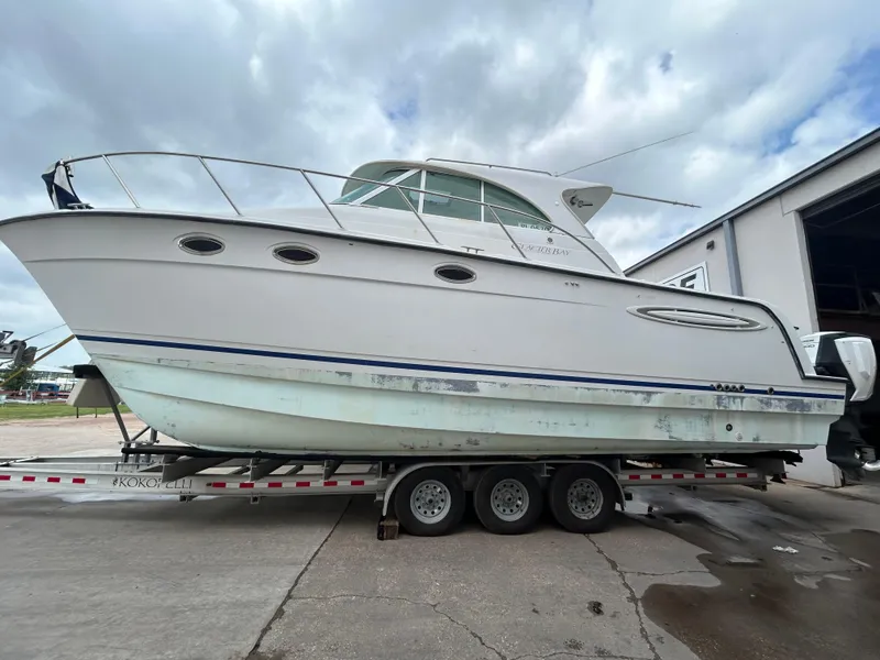Slide: The Image of 2004 Glacier Bay 3480 Ocean Runner boat on trailer, parked outdoors. - 4