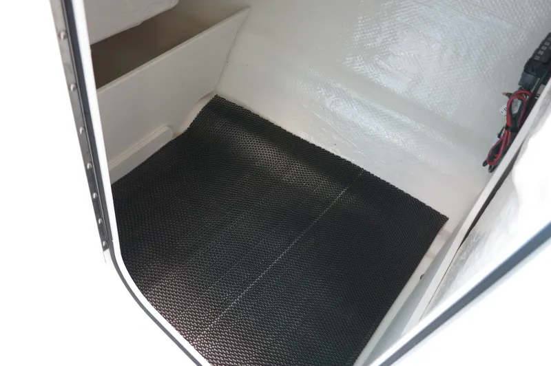 Slide: The Image of Interior view of 2024 Chaparral 23 SSi OB boat storage compartment. - 13