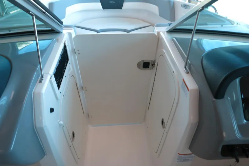 Slide: The Image of 2024 Chaparral 23 SSi OB boat interior with open cockpit and seating area. - 14