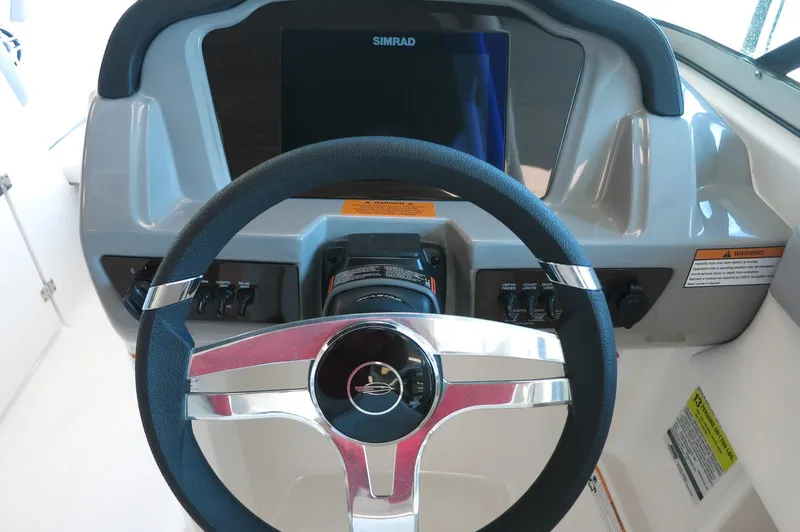Slide: The Image of Steering wheel and dashboard of 2024 Chaparral 23 SSi OB boat. - 18