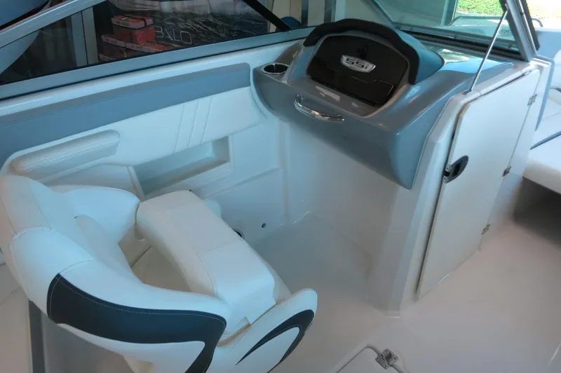 Slide: The Image of 2024 Chaparral 23 SSi OB boat interior with modern helm and seating. - 20