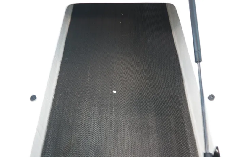 Slide: The Image of 2024 Chaparral 23 SSi OB boat deck with black non-slip surface. - 23