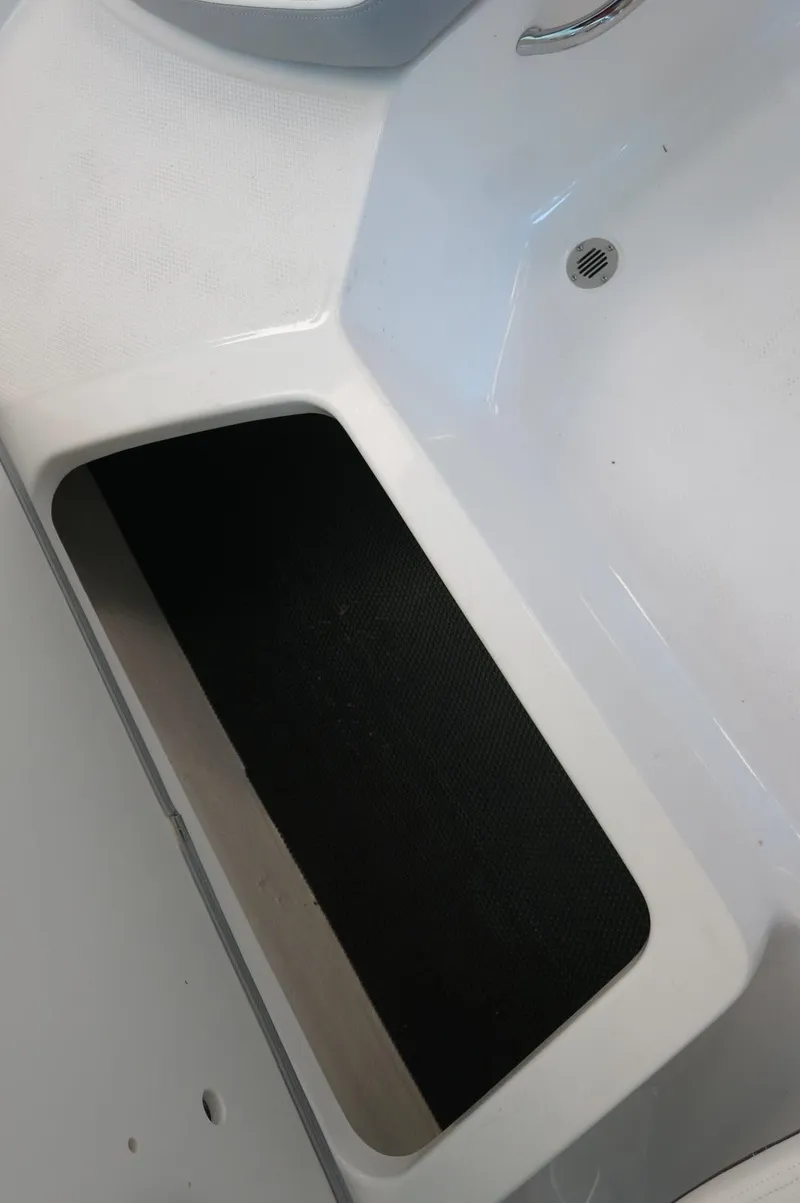 Slide: The Image of 2024 Chaparral 23 SSi OB boat interior storage compartment. - 26