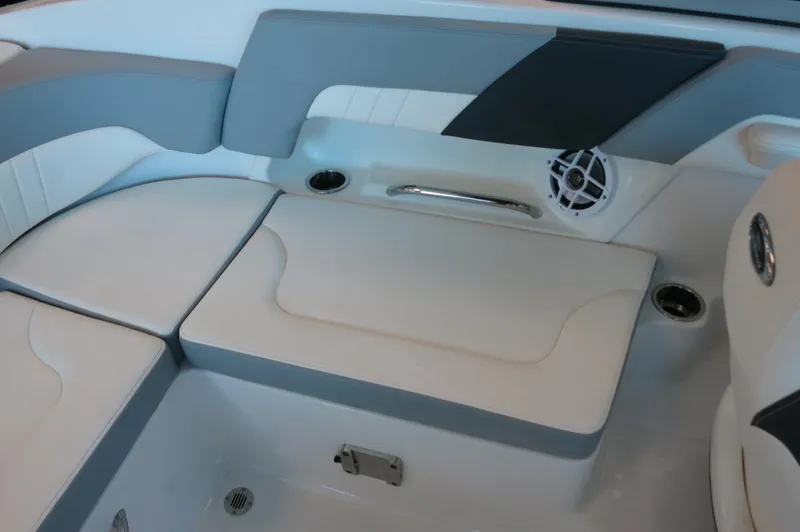 Slide: The Image of 2024 Chaparral 23 SSi OB boat interior with cushioned seating and speaker. - 27