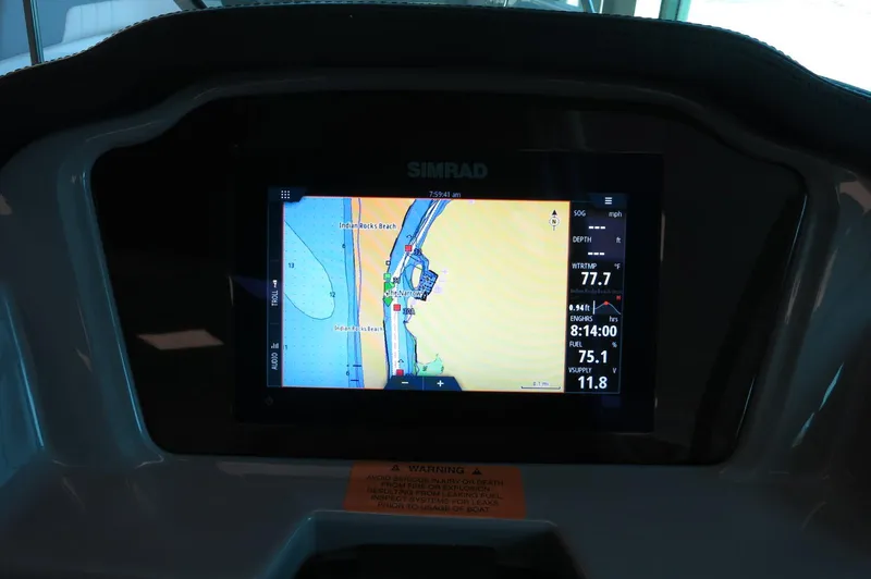 Slide: The Image of 2024 Chaparral 23 SSi OB boat dashboard with Simrad navigation display. - 37
