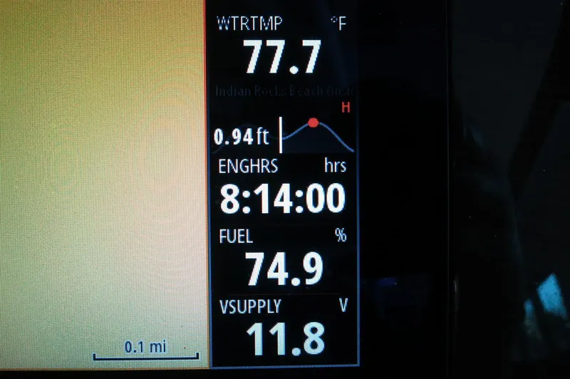 Slide: The Image of Dashboard display of 2024 Chaparral 23 SSi OB showing water temperature and fuel level. - 38