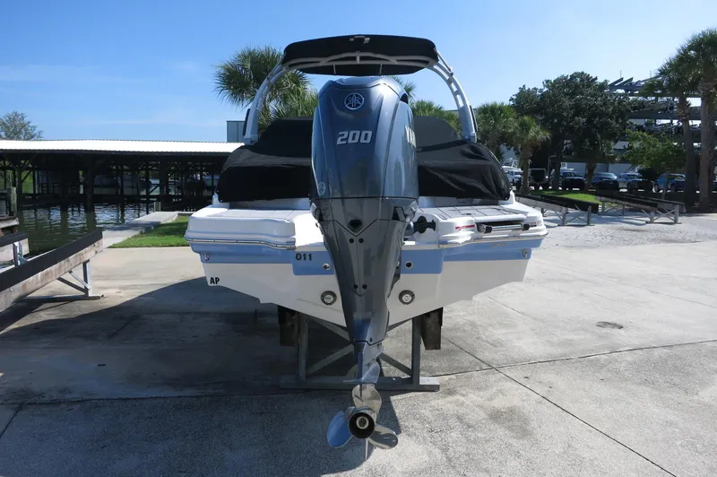 Slide: The Image of 2024 Chaparral 23 SSi OB boat with Yamaha 200 outboard engine, docked outdoors. - 41