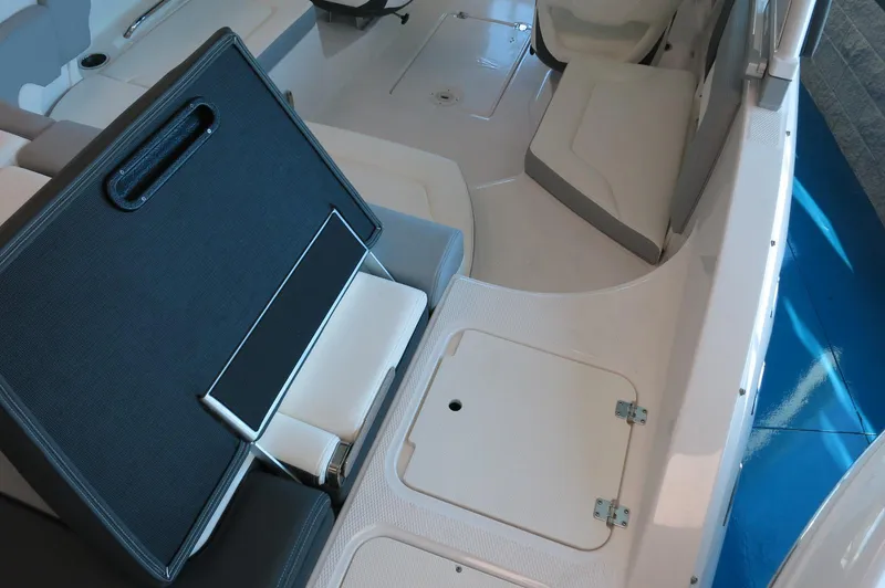 Slide: The Image of 2024 Chaparral 23 SSi OB boat interior seating and storage compartments. - 7
