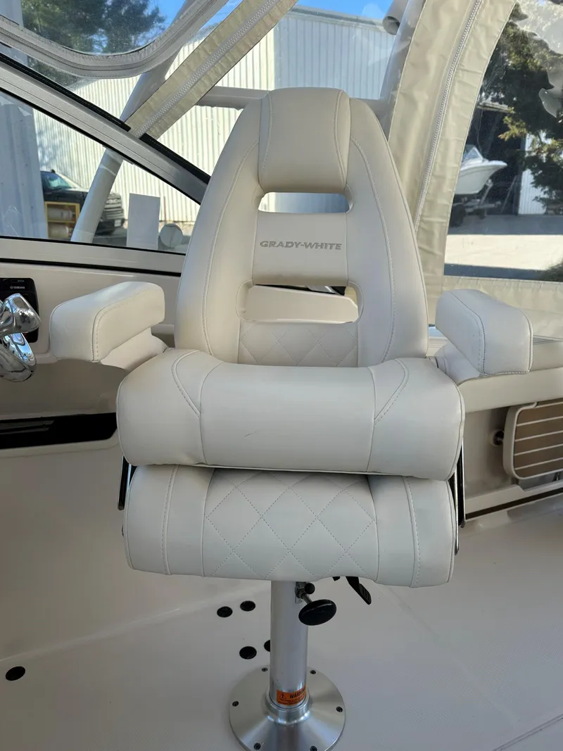 Slide: The Image of 2021 Grady-White Freedom 235 boat seat, white leather, luxurious design. - 13