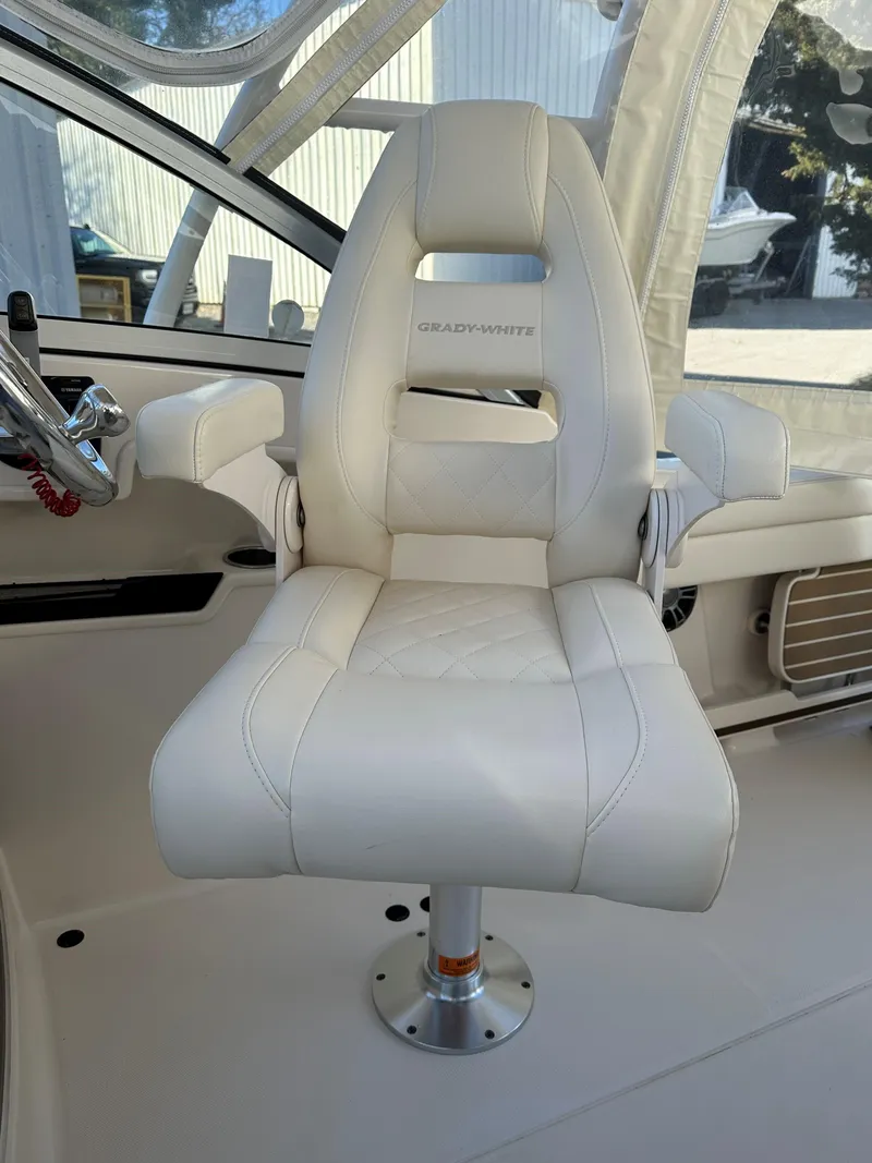 Slide: The Image of 2021 Grady-White Freedom 235 boat seat, white leather, modern design. - 14