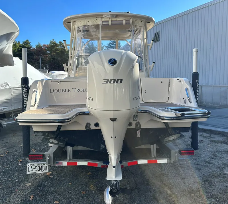Slide: The Image of 2021 Grady-White Freedom 235 boat with 300 horsepower engine, parked on trailer. - 3