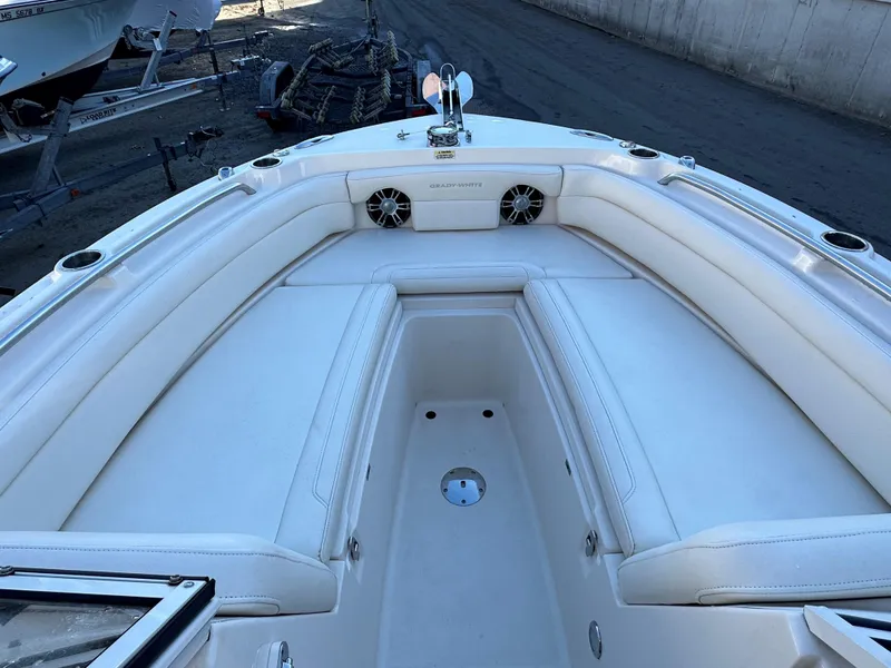 Slide: The Image of 2021 Grady-White Freedom 235 boat interior with white seating and cup holders. - 4