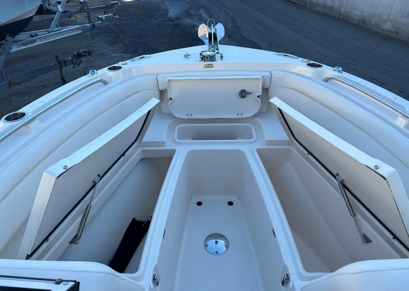 Slide: The Image of 2021 Grady-White Freedom 235 boat interior with open storage compartments. - 5