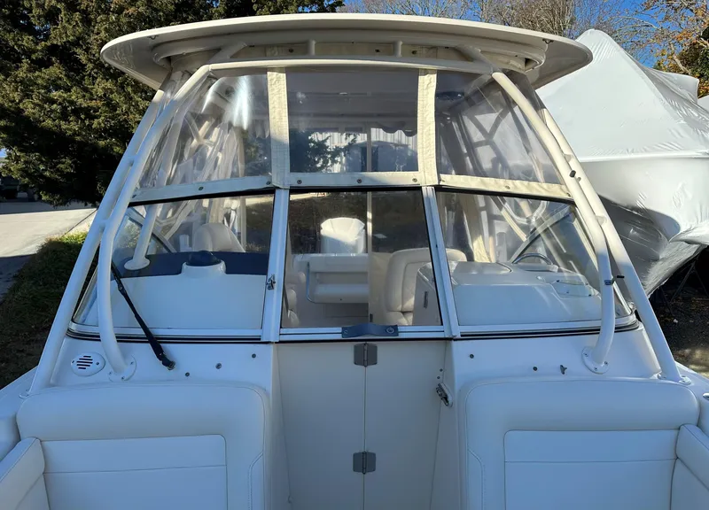 Slide: The Image of 2021 Grady-White Freedom 235 boat with enclosed cockpit and seating. - 7