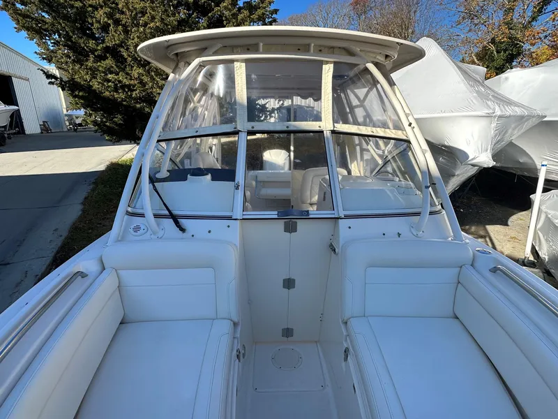 Slide: The Image of 2021 Grady-White Freedom 235 boat with white seating and enclosed cockpit. - 8