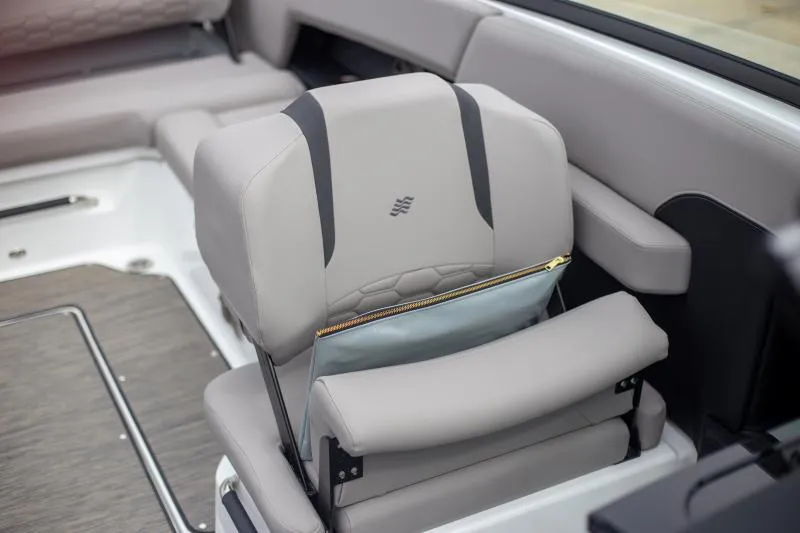 Slide: The Image of 2025 Four Winns H6 boat interior with luxurious seating and modern design. - 19