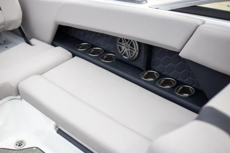 Slide: The Image of 2025 Four Winns H6 boat interior with cup holders and speaker. - 20