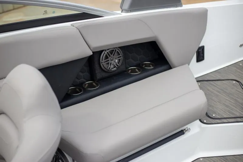 Slide: The Image of 2025 Four Winns H6 boat interior with cushioned seating and integrated cup holders. - 21