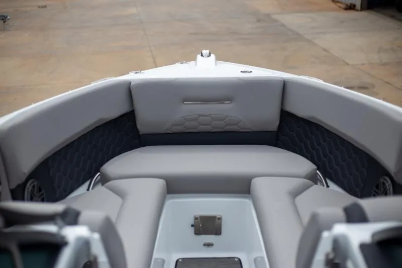 Slide: The Image of 2025 Four Winns H6 boat interior with gray seating and modern design. - 7