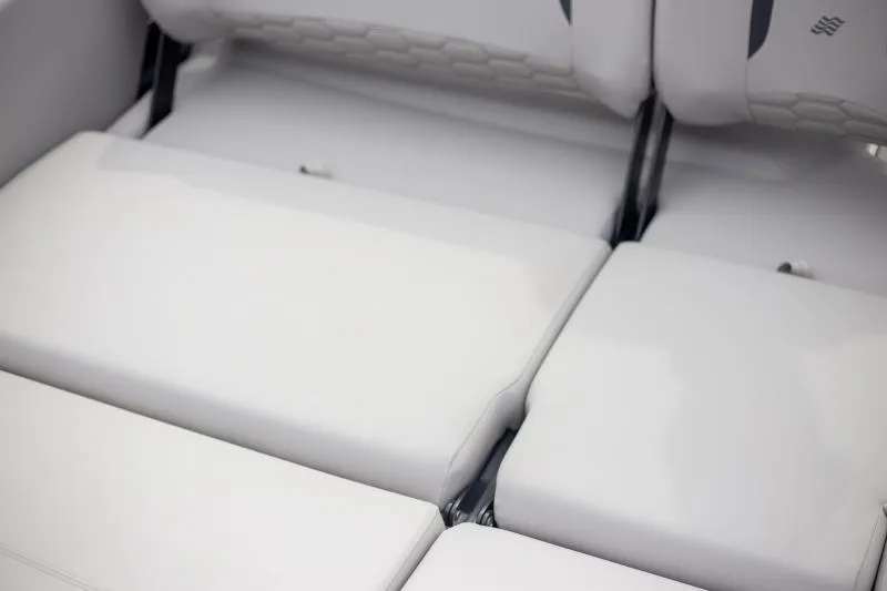Slide: The Image of 2025 Four Winns H6 boat interior with white cushioned seating. - 8