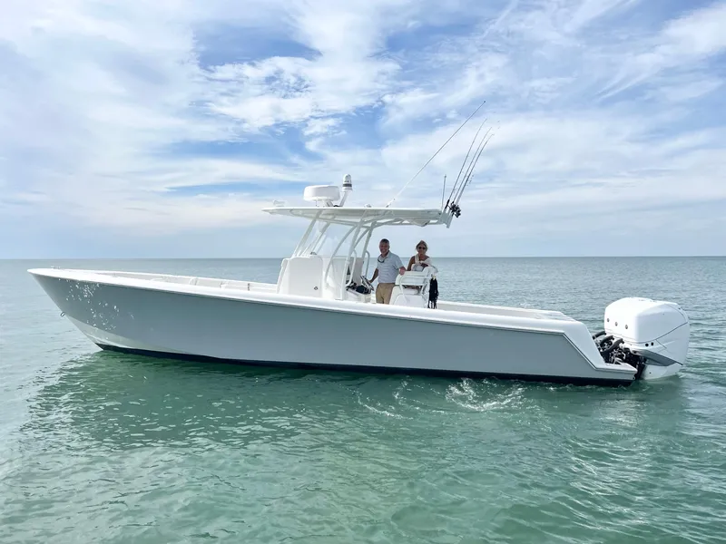 Slide: The Image of 2020 Contender 35 ST boat on calm ocean waters under a cloudy sky. - 0
