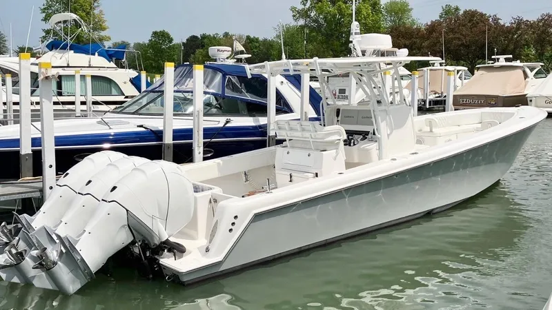 Slide: The Image of 2020 Contender 35 ST boat docked with triple outboard engines. - 4