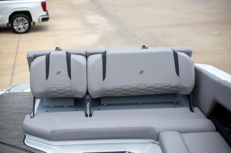 Slide: The Image of 2025 Four Winns H6 boat interior with gray seating and modern design. - 14