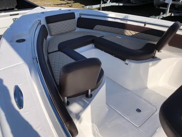 Slide: The Image of 2024 Reflex Gladiator boat interior with cushioned seating and modern design. - 10