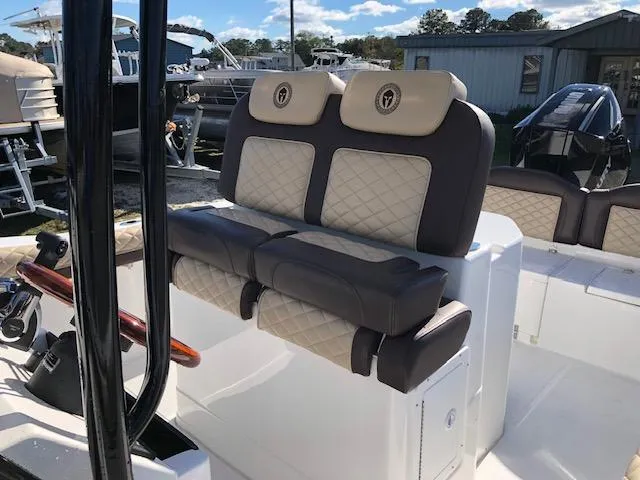 Slide: The Image of 2024 Reflex Gladiator boat seats with quilted design and beige-brown upholstery. - 11