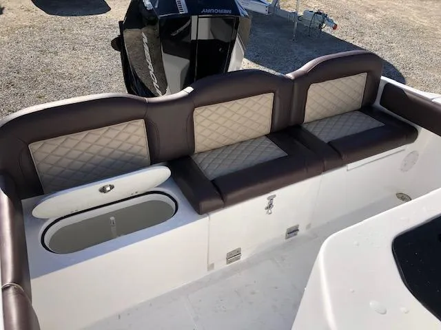 Slide: The Image of 2024 Reflex Gladiator boat seating with storage compartments and quilted upholstery. - 14