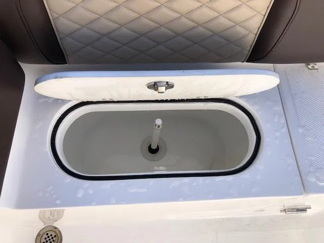 Slide: The Image of Open storage compartment in 2024 Reflex Gladiator boat. - 18