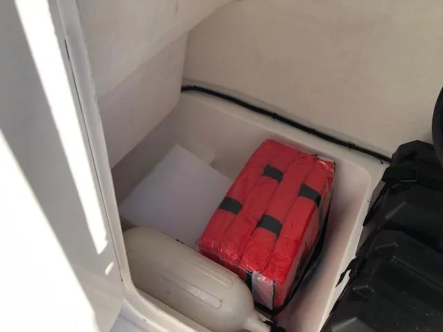 Slide: The Image of Boat storage compartment with life jacket and equipment, Reflex Gladiator 2024 model. - 20