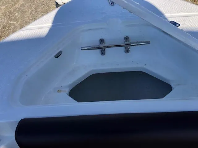 Slide: The Image of Open storage compartment on 2024 Reflex Gladiator boat. - 24